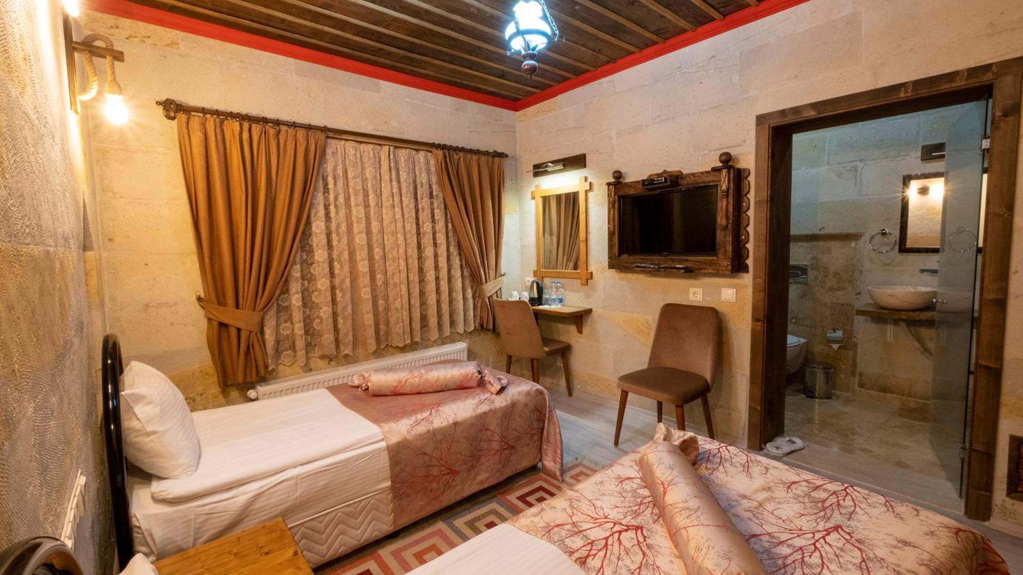 In Stone House Hotel Гьореме Стая снимка