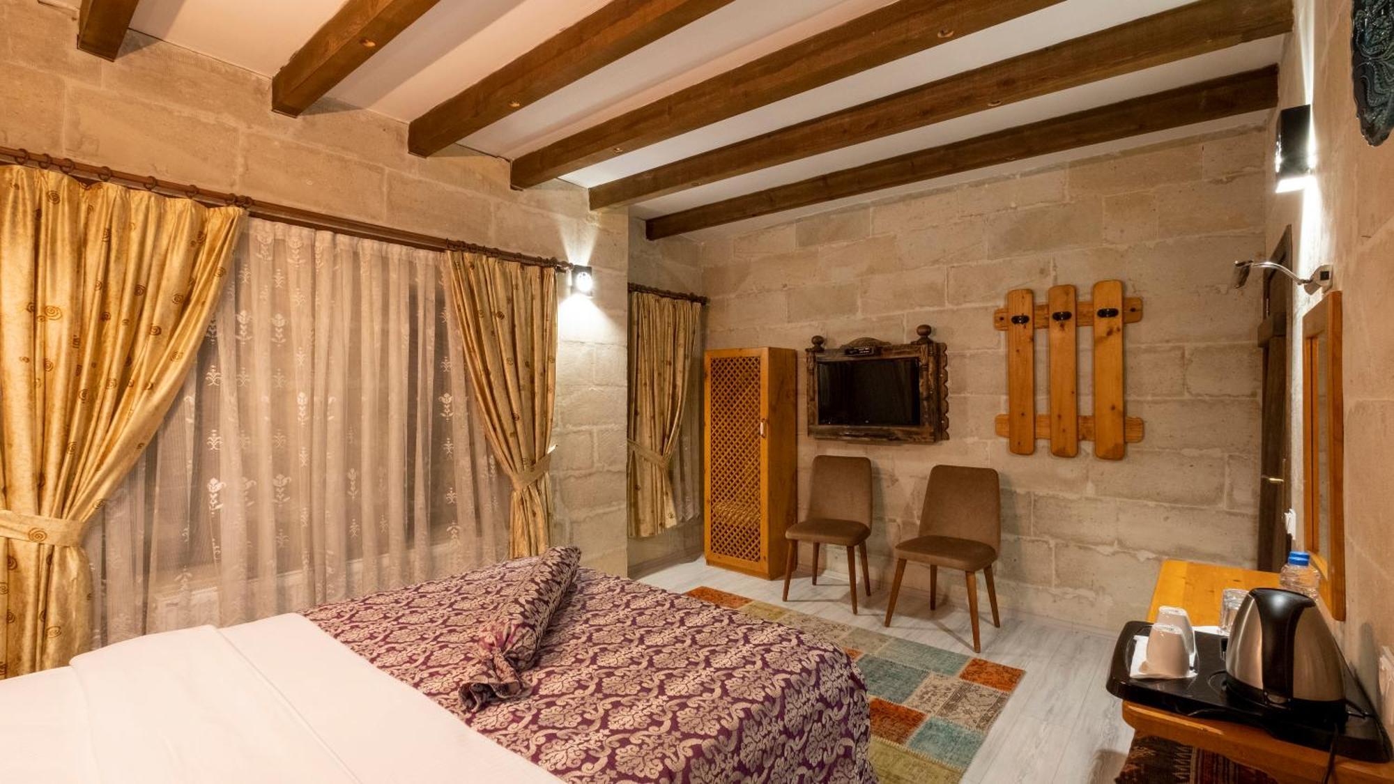 In Stone House Hotel Гьореме Стая снимка